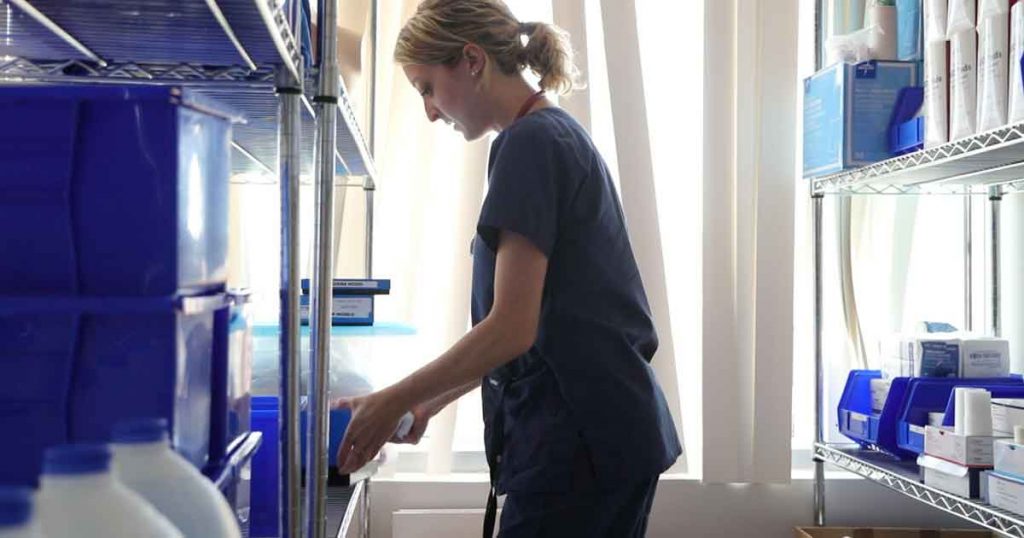 nursing student standing in medical supply closet